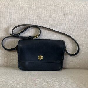 Vintage black leather Coach shoulder bag.